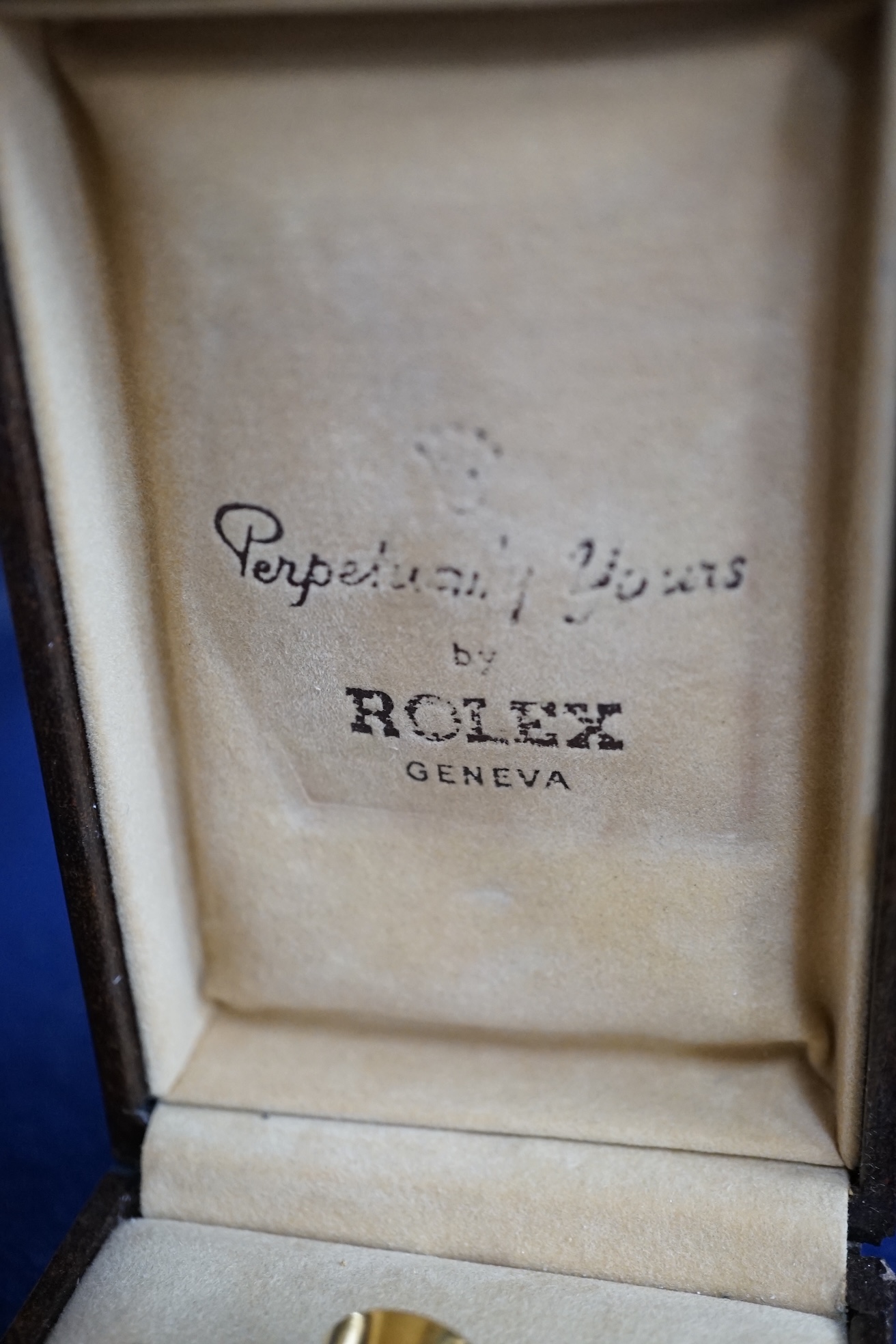 A Rolex “Perpetually Yours” enamelled scent bottle, boxed. Condition - fair to good